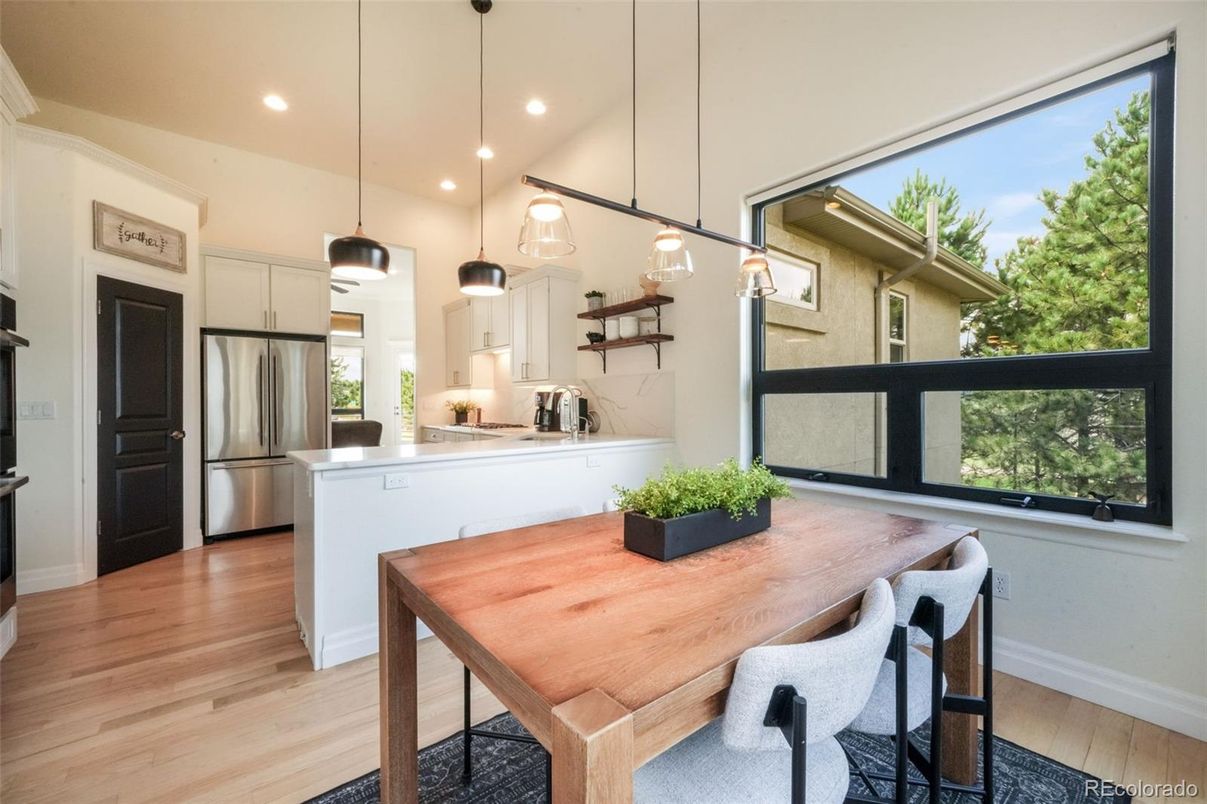 Dining room, Interior, Kitchen, Pendant Lights, Recessed Lighting, Stainless Steel Appliances, Wood Texture Flooring