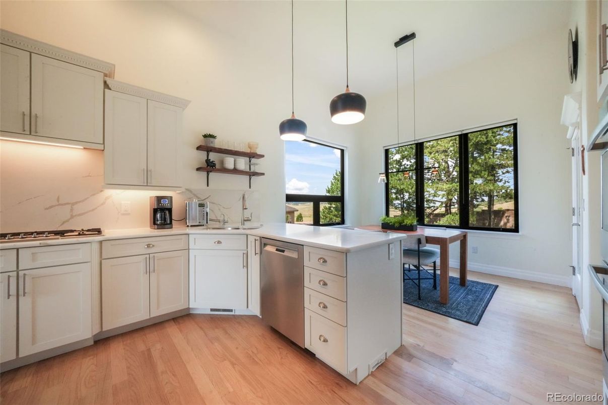 Dining room, Interior, Kitchen, Pendant Lights, Stainless Steel Appliances, Wood Texture Flooring