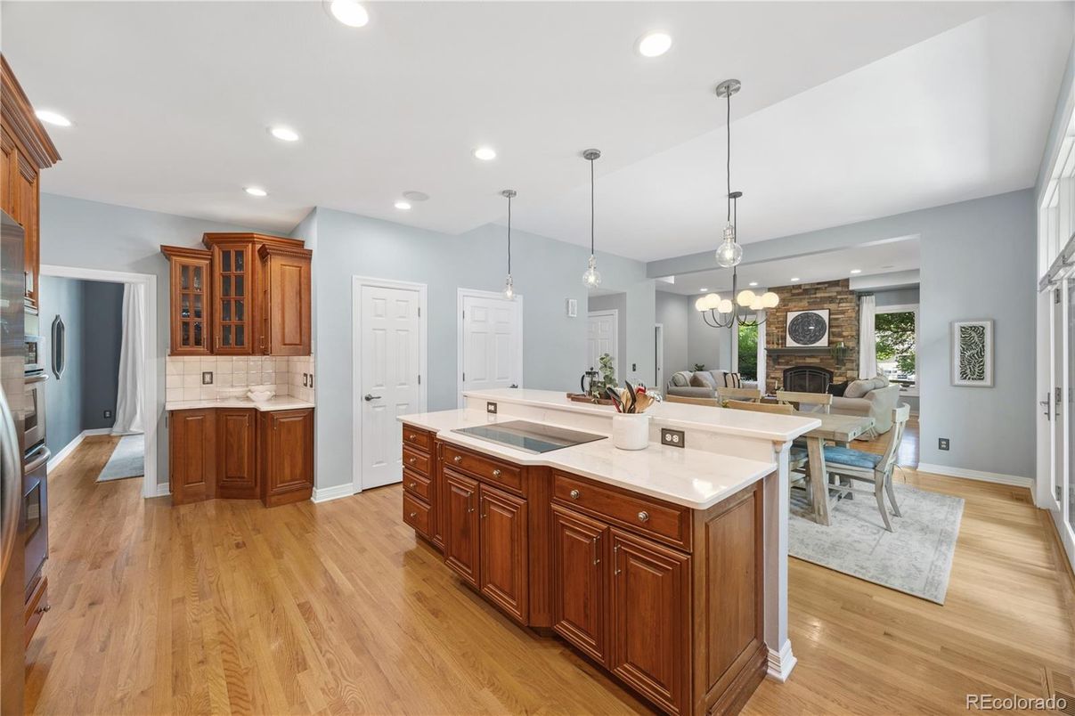Dining room, Fireplace, Interior, Kitchen, Living room, Pendant Lights, Recessed Lighting, Tile Countertops, Wood Texture Flooring