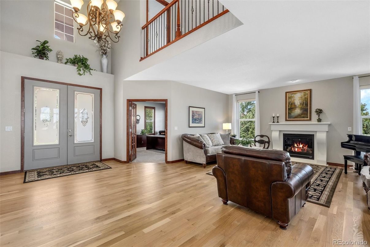 Chandelier, Fireplace, Interior, Living room, Piano, Wood Texture Flooring