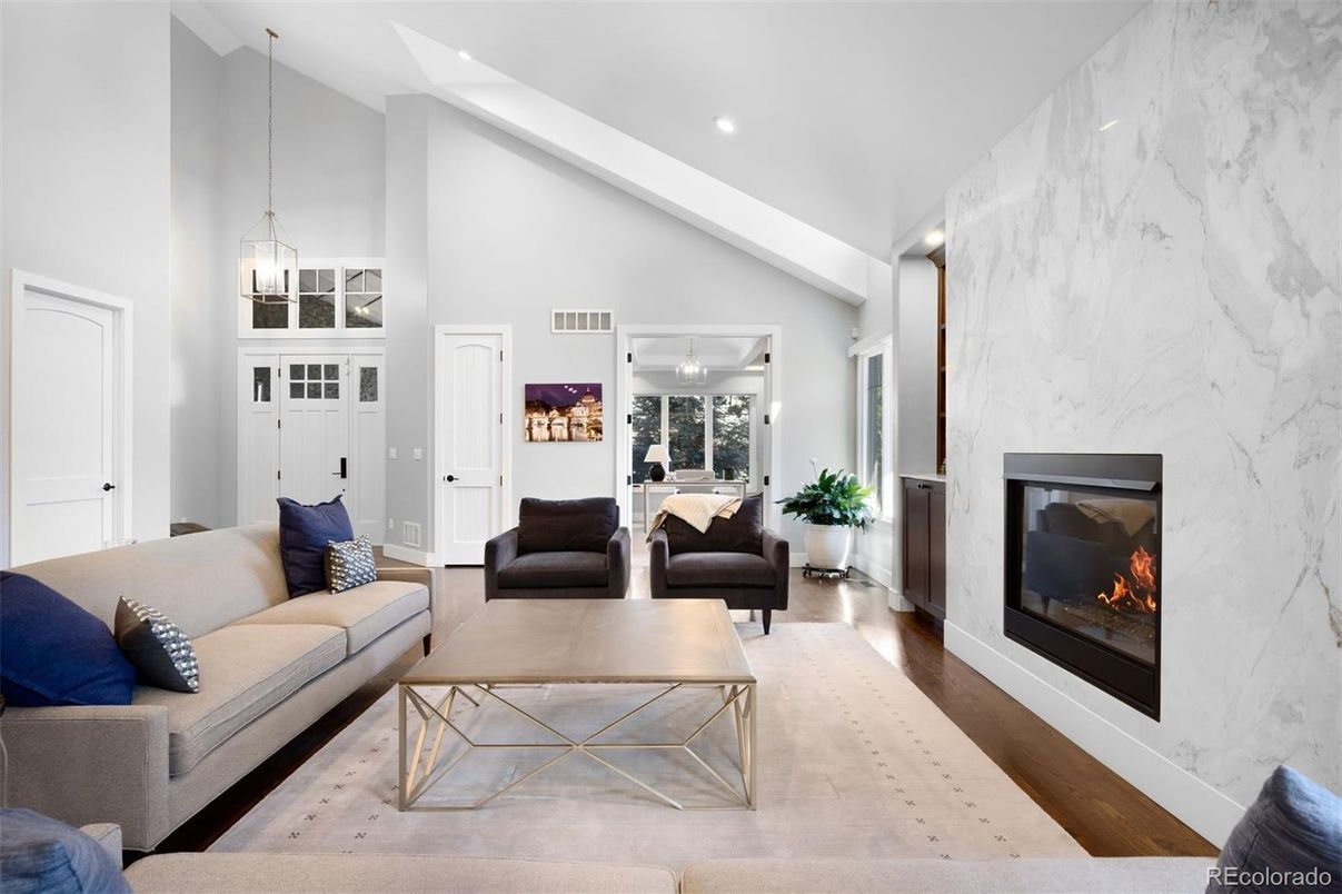 Fireplace, Interior, Living room, Marble Walls, Pendant Lights, Recessed Lighting, Wood Texture Flooring