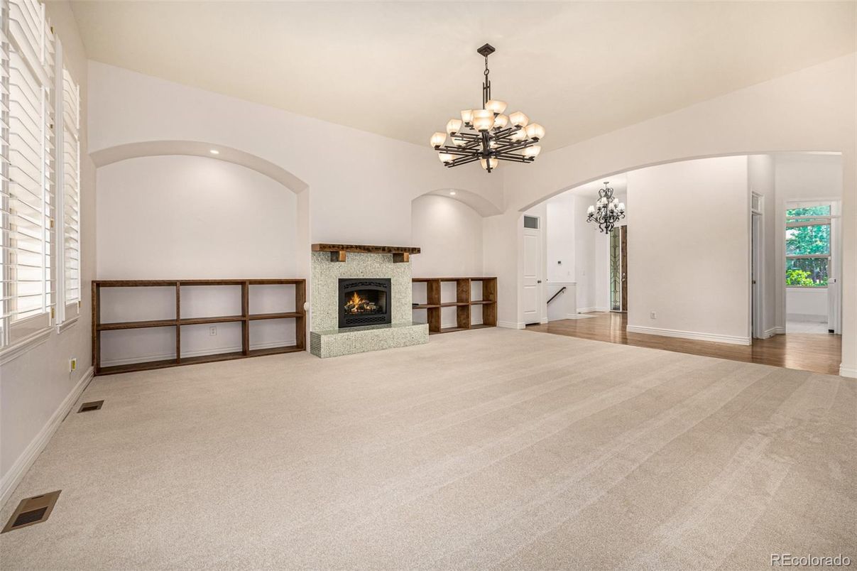 Chandelier, Empty room, Fireplace, Interior, Recessed Lighting, Wood Texture Flooring
