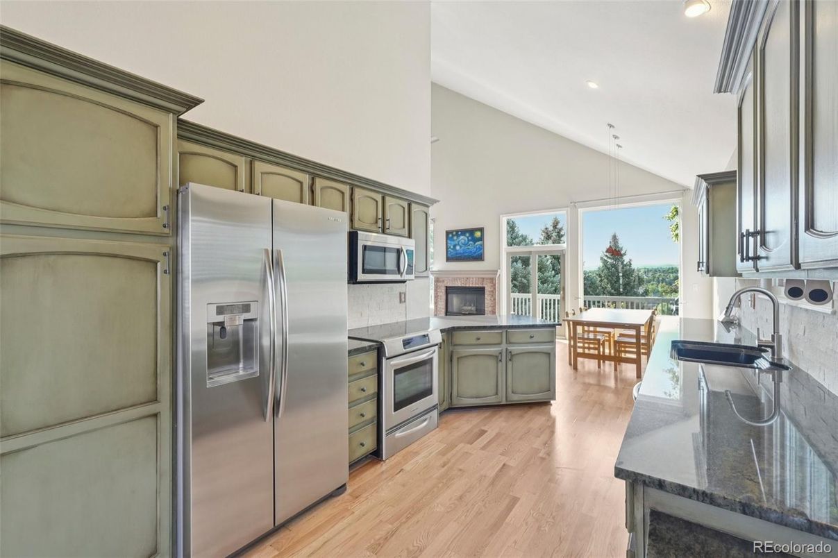 Dining room, Fireplace, Interior, Kitchen, Pendant Lights, Recessed Lighting, Stainless Steel Appliances, Wood Texture Flooring