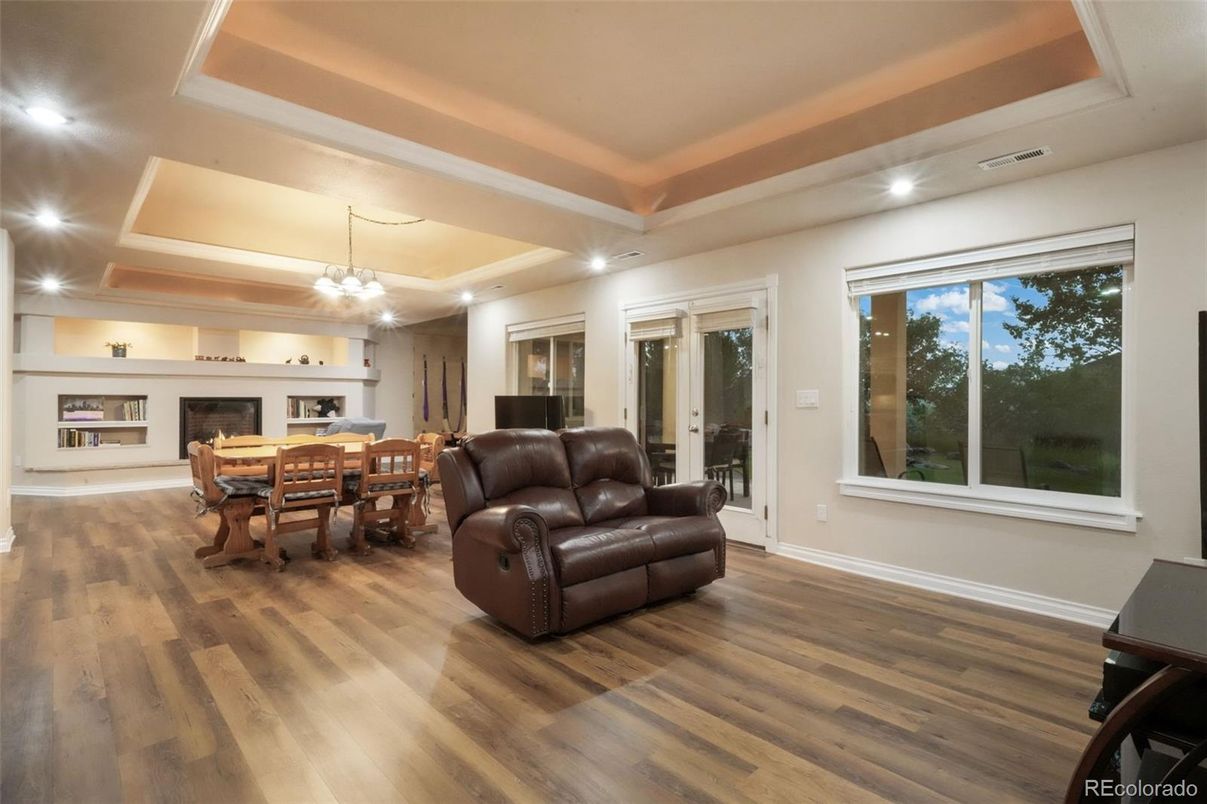 Dining room, Fireplace, Interior, Living room, Recessed Lighting, Wood Texture Flooring