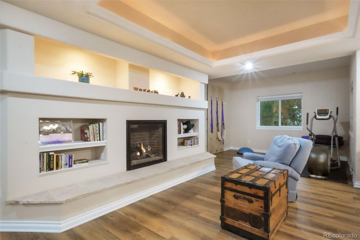Fireplace, Fitness Equipment, Interior, Recessed Lighting, Wood Texture Flooring