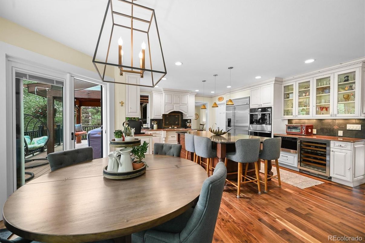 Dining room, Fireplace, Interior, Kitchen, Pendant Lights, Recessed Lighting, Stainless Steel Appliances, Wood Texture Flooring