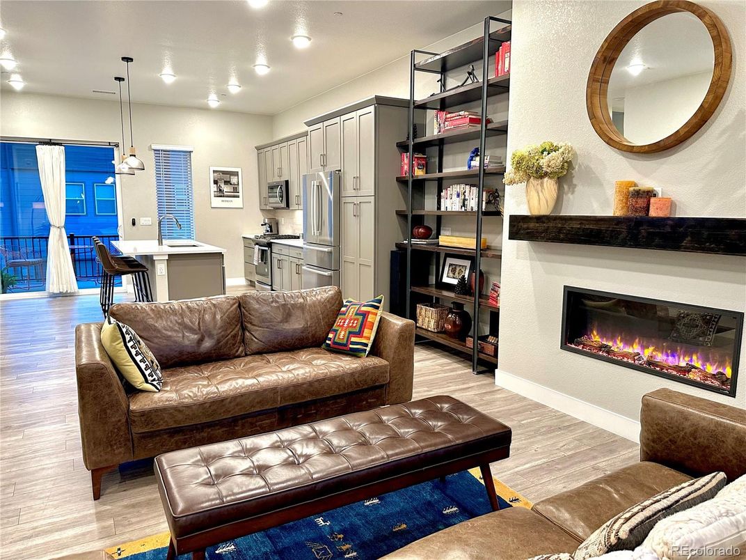 Fireplace, Interior, Kitchen, Living room, Pendant Lights, Recessed Lighting, Stainless Steel Appliances, Wood Texture Flooring