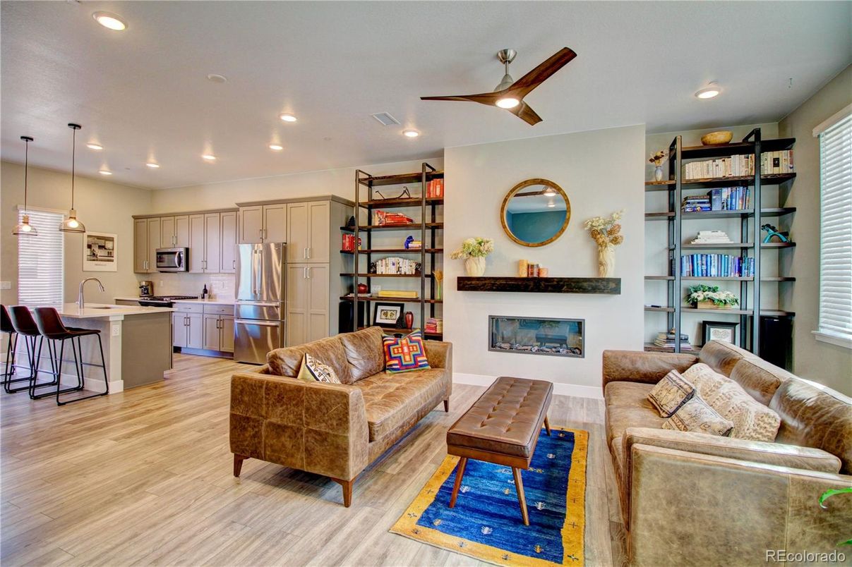 Fireplace, Interior, Kitchen, Living room, Pendant Lights, Recessed Lighting, Stainless Steel Appliances, Wood Texture Flooring