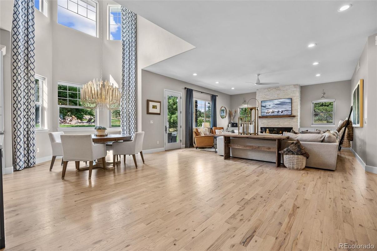Chandelier, Dining room, Fireplace, Interior, Living room, Recessed Lighting, Stone Walls, Wood Texture Flooring