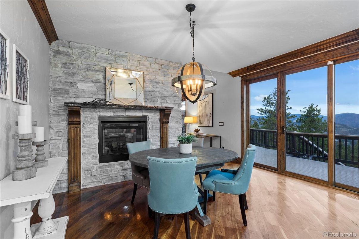 Dining room, Fireplace, Interior, Pendant Lights, Stone Walls, Wood Texture Flooring