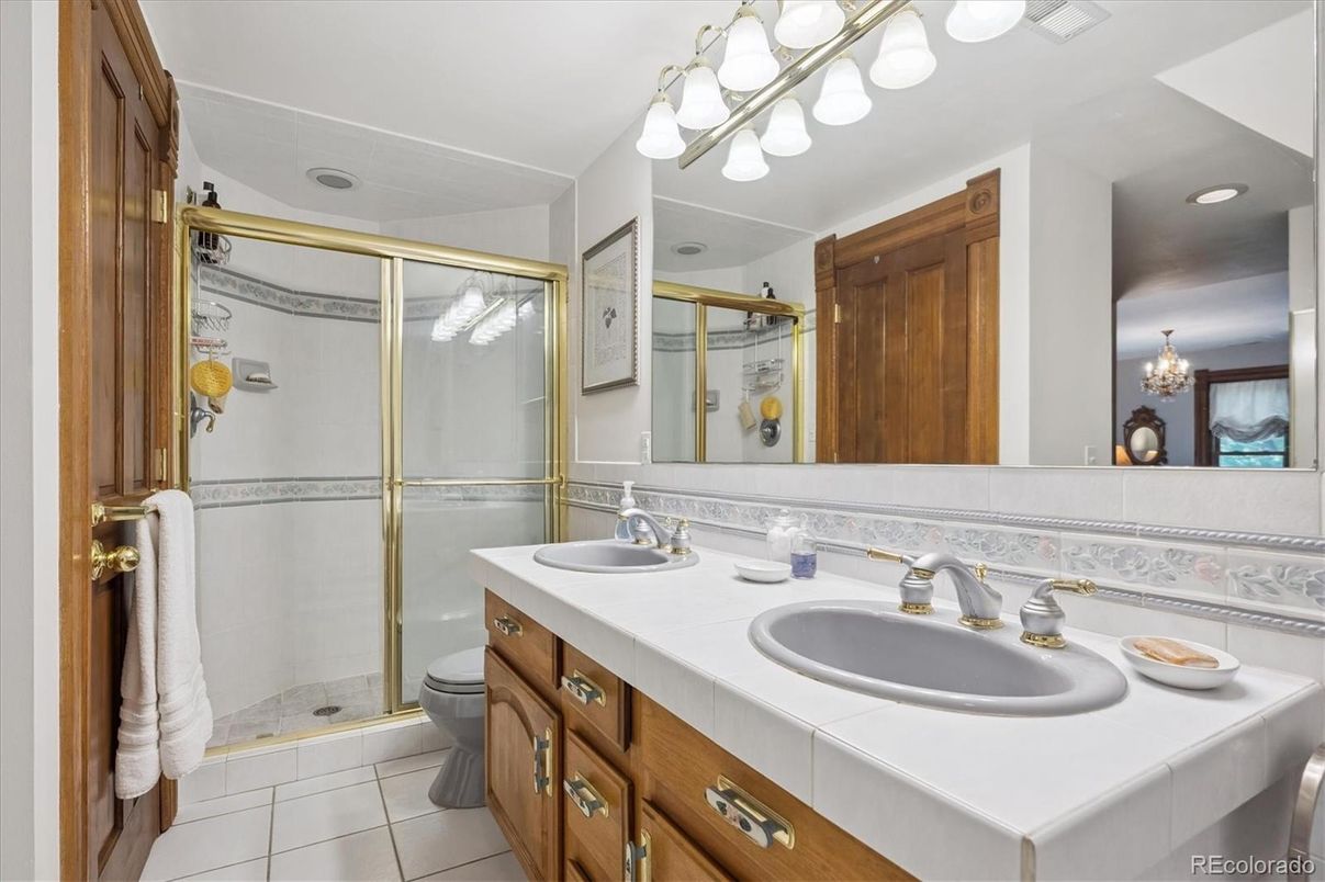 Bathroom, Dual Sink Vanities, Glass Shower, Interior, Recessed Lighting, Tile Countertops