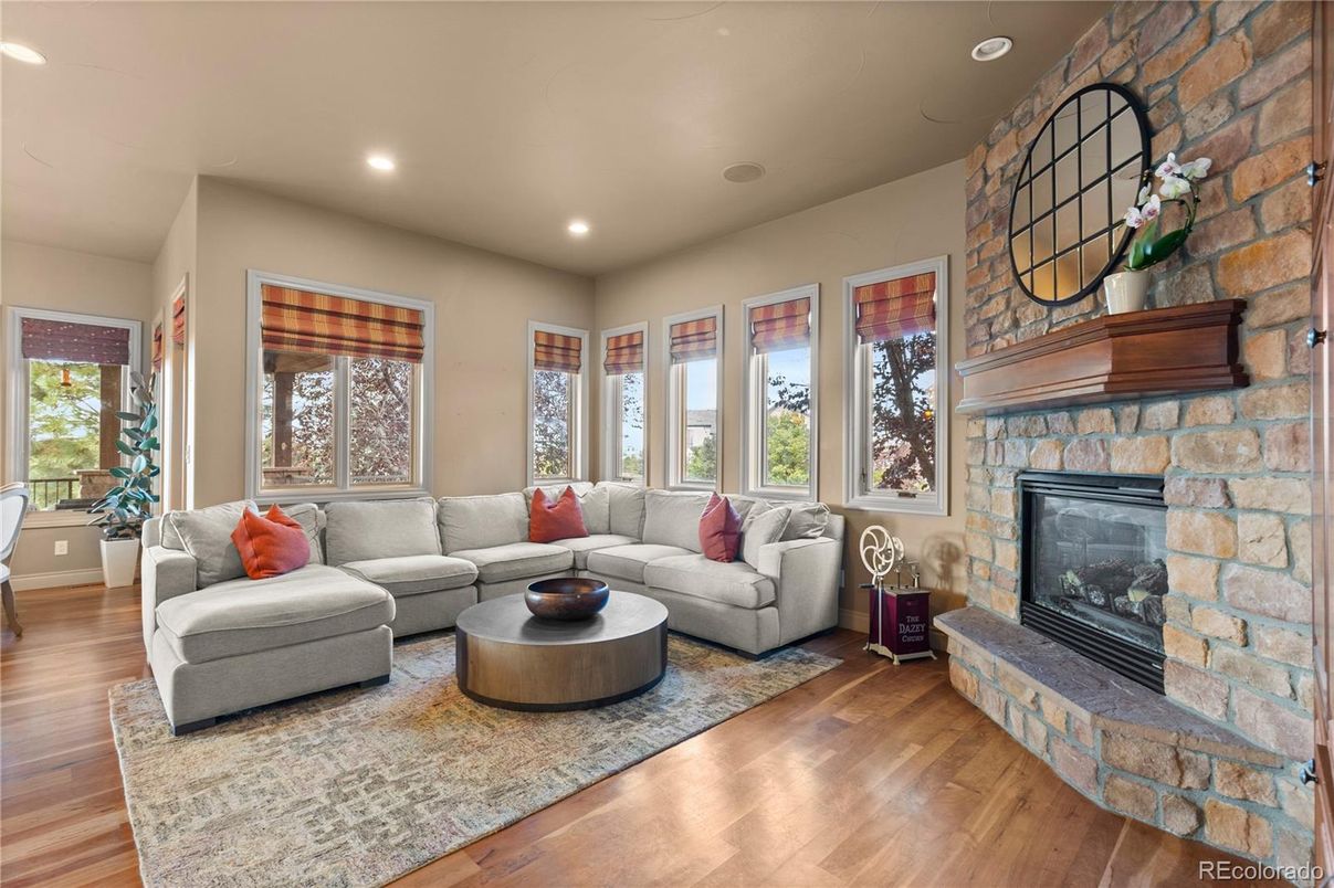 Fireplace, Interior, Living room, Recessed Lighting, Stone Walls, Wood Texture Flooring