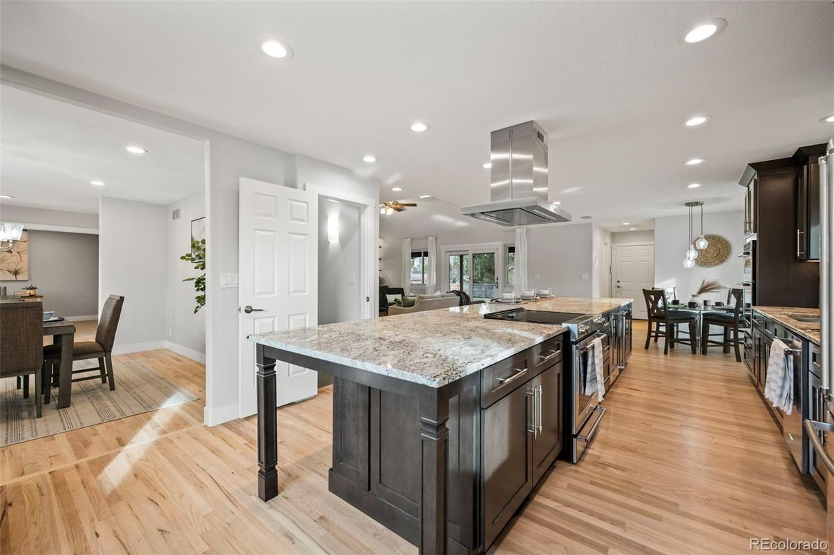 Dining room, Interior, Kitchen, Pendant Lights, Recessed Lighting, Stainless Steel Appliances, Wood Texture Flooring