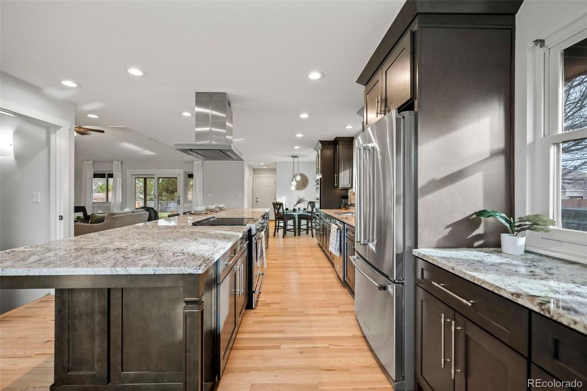 Dining room, Interior, Kitchen, Pendant Lights, Recessed Lighting, Stainless Steel Appliances, Wood Texture Flooring