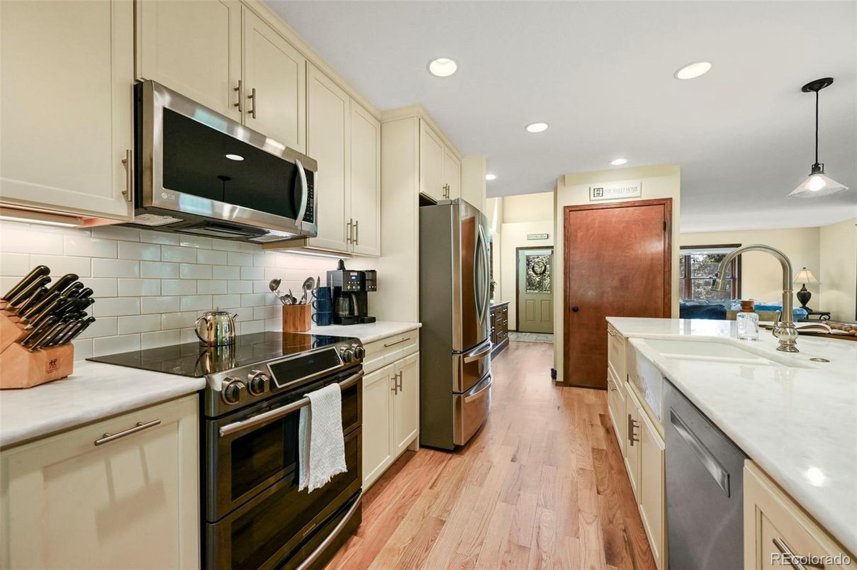 Interior, Kitchen, Pendant Lights, Recessed Lighting, Stainless Steel Appliances, Wood Texture Flooring