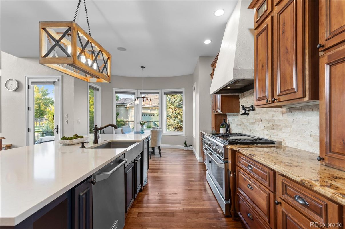 Dining room, Interior, Kitchen, Pendant Lights, Recessed Lighting, Stainless Steel Appliances, Wood Texture Flooring