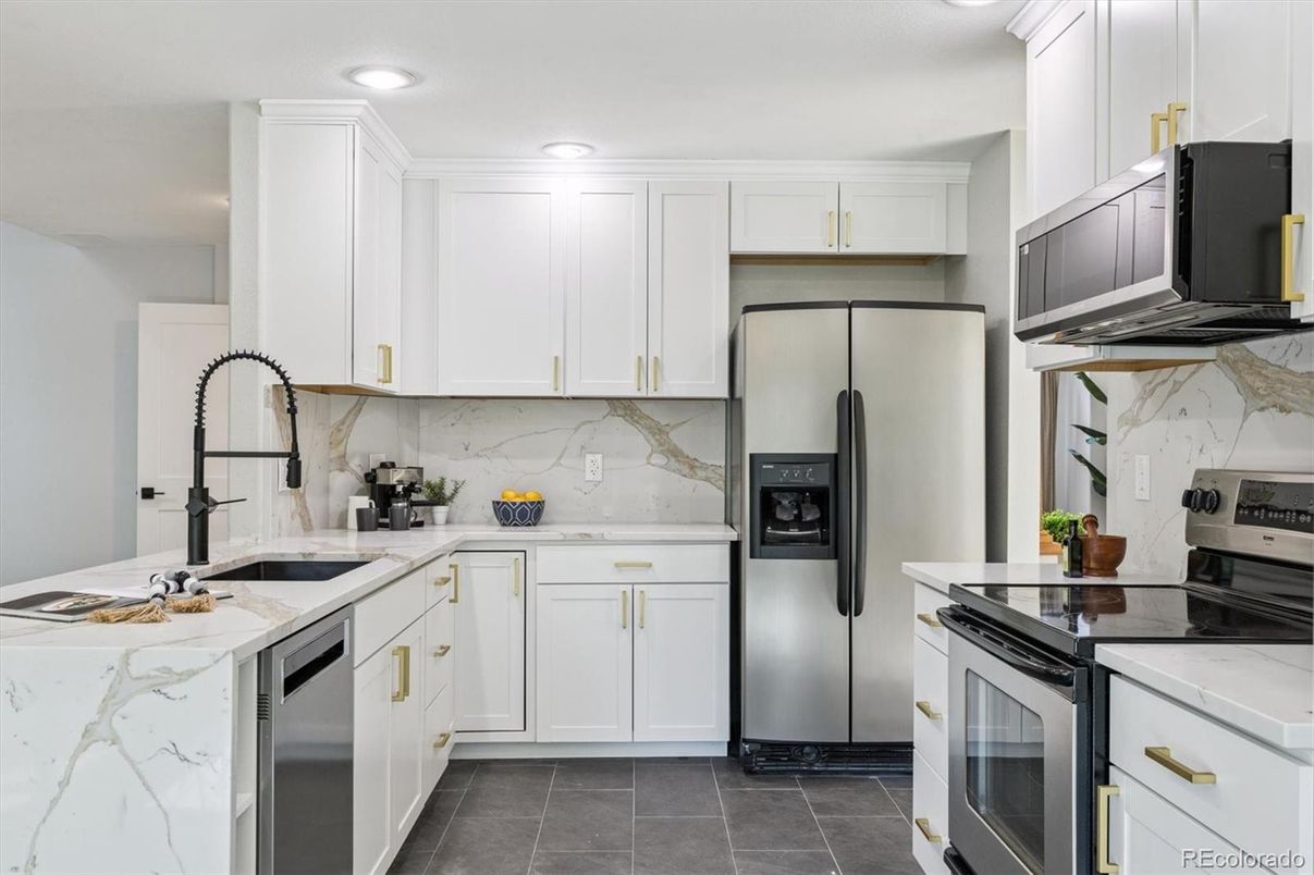 Interior, Kitchen, Marble Walls, Recessed Lighting, Stainless Steel Appliances