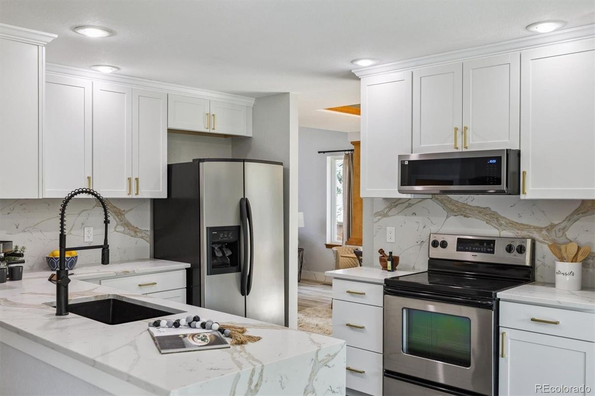 Interior, Kitchen, Marble Walls, Recessed Lighting, Stainless Steel Appliances