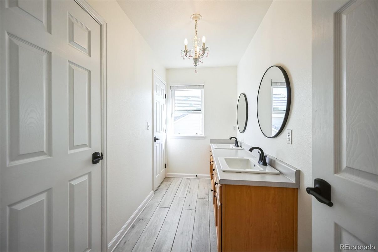 Bathroom, Chandelier, Dual Sink Vanities, Interior, Wood Texture Flooring