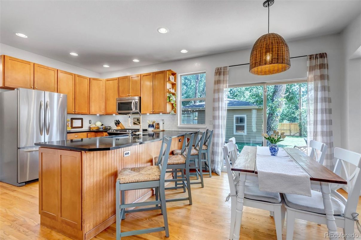 Dining room, Interior, Kitchen, Pendant Lights, Recessed Lighting, Stainless Steel Appliances, Wood Texture Flooring