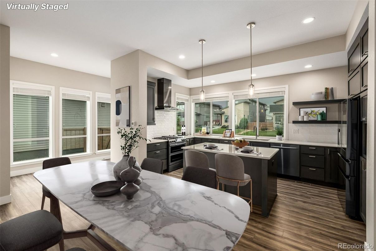 Dining room, Interior, Kitchen, Pendant Lights, Recessed Lighting, Stainless Steel Appliances, Wood Texture Flooring