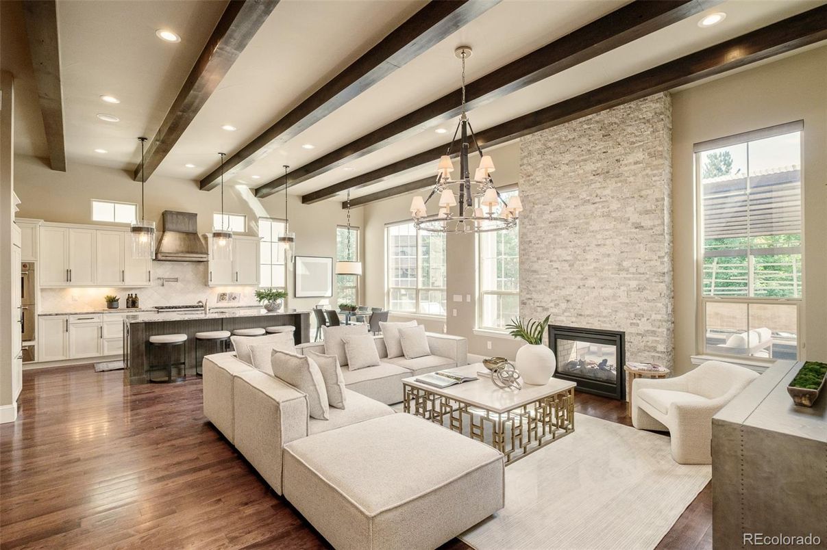 Chandelier, Dining room, Fireplace, Interior, Kitchen, Living room, Pendant Lights, Recessed Lighting, Stone Walls, Wooden Beams, Wood Texture Flooring