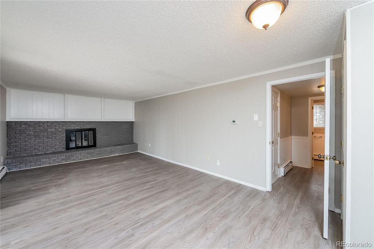 Empty room, Fireplace, Interior, Stone Walls, Wood Texture Flooring