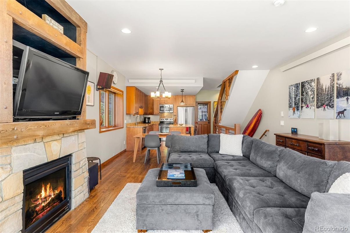 Chandelier, Dining room, Fireplace, Interior, Kitchen, Living room, Pendant Lights, Recessed Lighting, Wood Texture Flooring