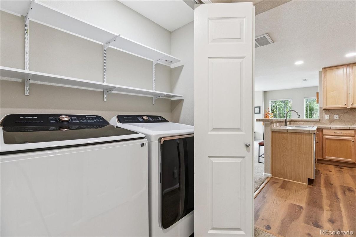 Interior, Kitchen, Recessed Lighting, Washer, Wood Texture Flooring