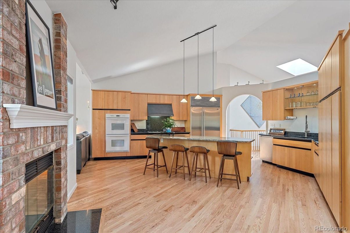 Fireplace, Interior, Kitchen, Pendant Lights, Stainless Steel Appliances, Wood Texture Flooring