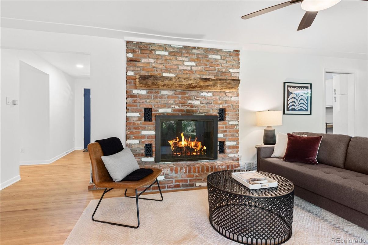 Fireplace, Interior, Living room, Recessed Lighting, Stone Walls, Wood Texture Flooring