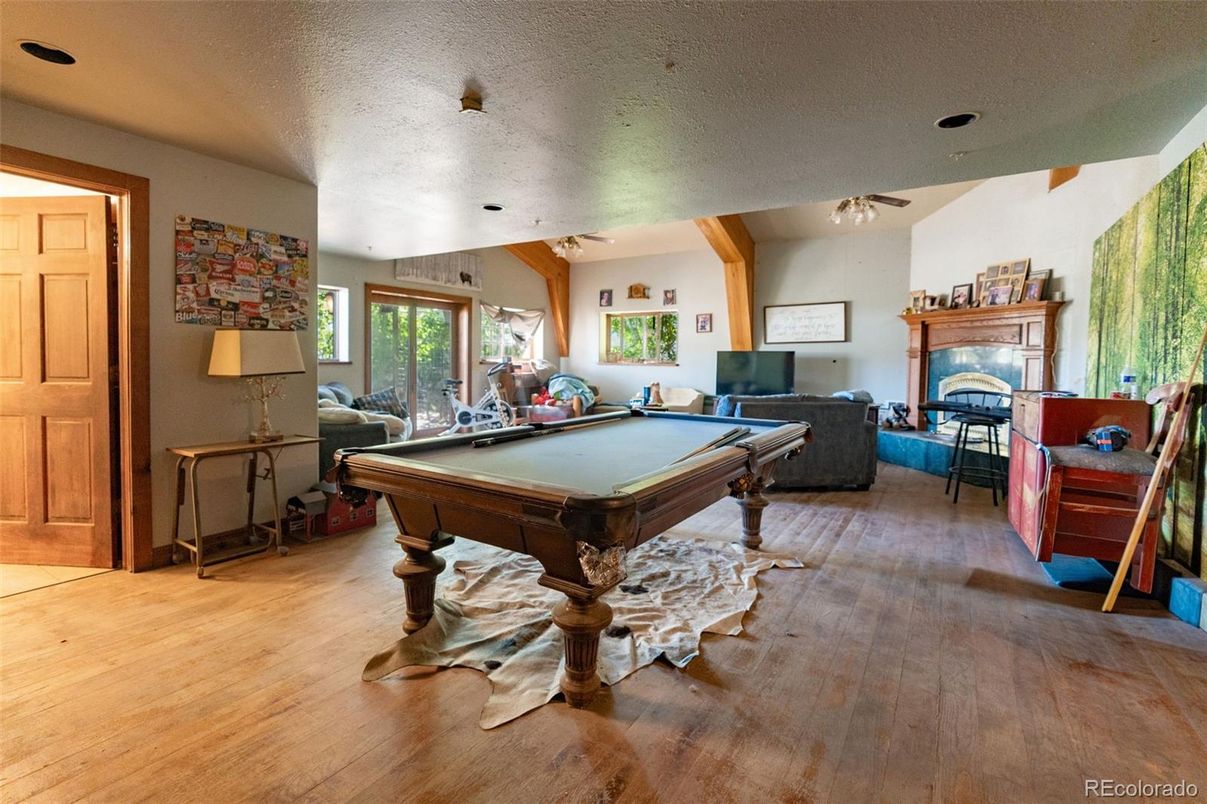 Billiard Table, Fireplace, Game Room, Interior, Living room, Wood Texture Flooring