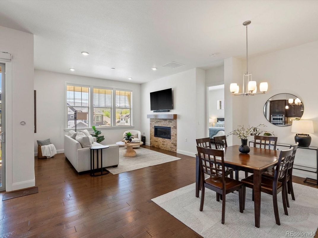 Dining room, Fireplace, Interior, Living room, Pendant Lights, Recessed Lighting, Wood Texture Flooring