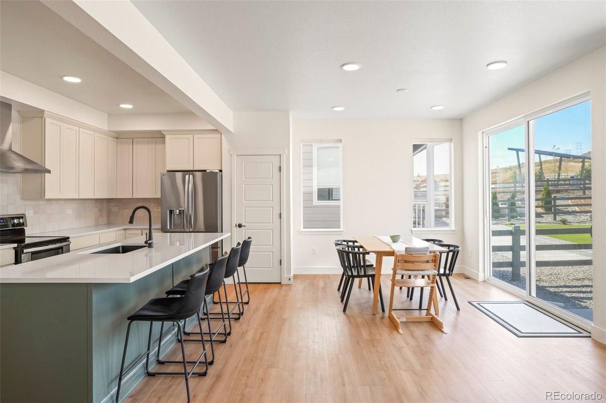 Dining room, Interior, Kitchen, Recessed Lighting, Stainless Steel Appliances, Wood Texture Flooring
