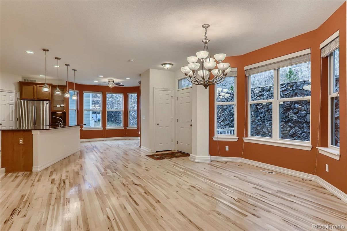 Chandelier, Empty room, Interior, Kitchen, Pendant Lights, Recessed Lighting, Stainless Steel Appliances, Wood Texture Flooring