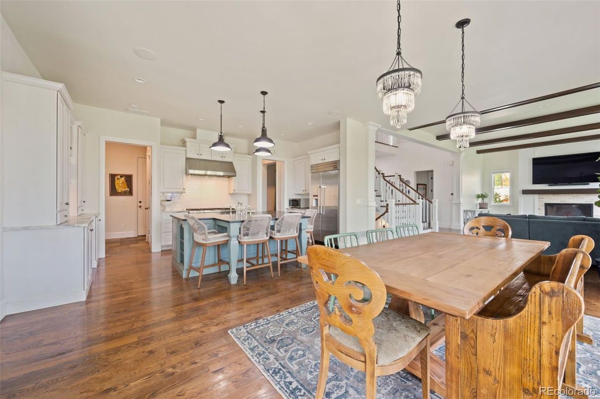 Chandelier, Dining room, Fireplace, Interior, Kitchen, Pendant Lights, Recessed Lighting, Stainless Steel Appliances, Wood Texture Flooring