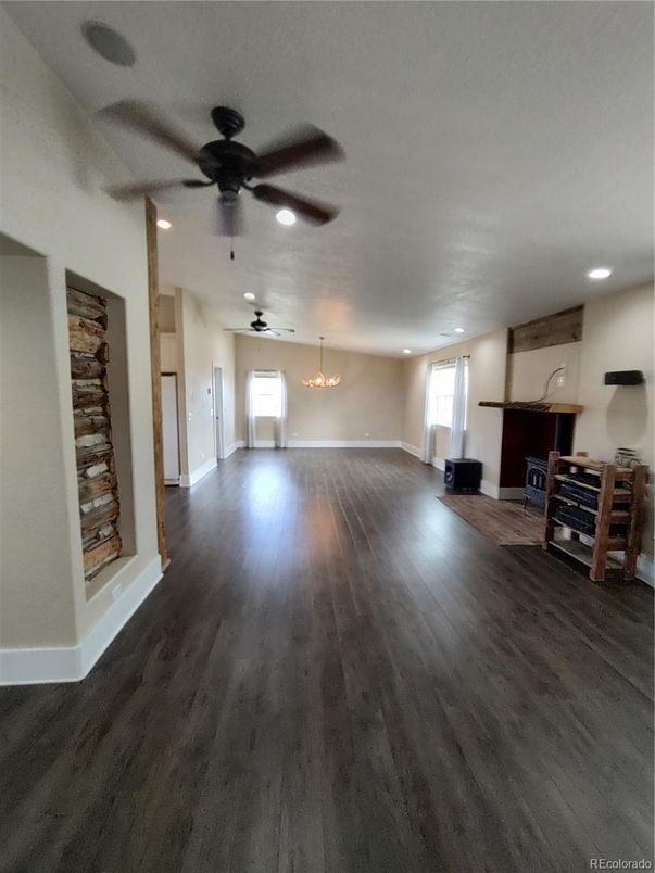 Chandelier, Empty room, Fireplace, Interior, Recessed Lighting, Wood Texture Flooring