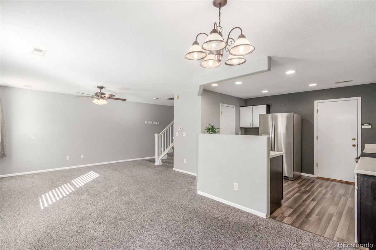 Chandelier, Empty room, Interior, Kitchen, Recessed Lighting, Stainless Steel Appliances, Wood Texture Flooring
