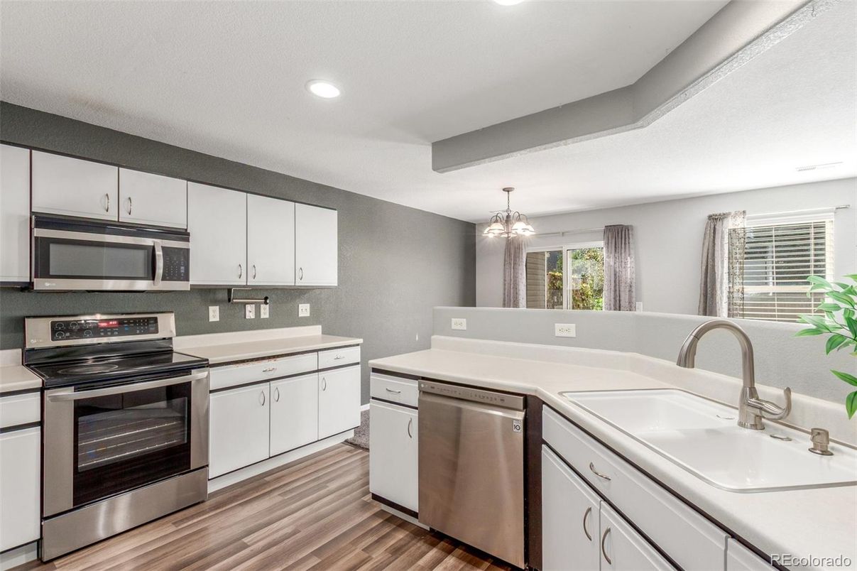 Chandelier, Interior, Kitchen, Recessed Lighting, Stainless Steel Appliances, Wood Texture Flooring