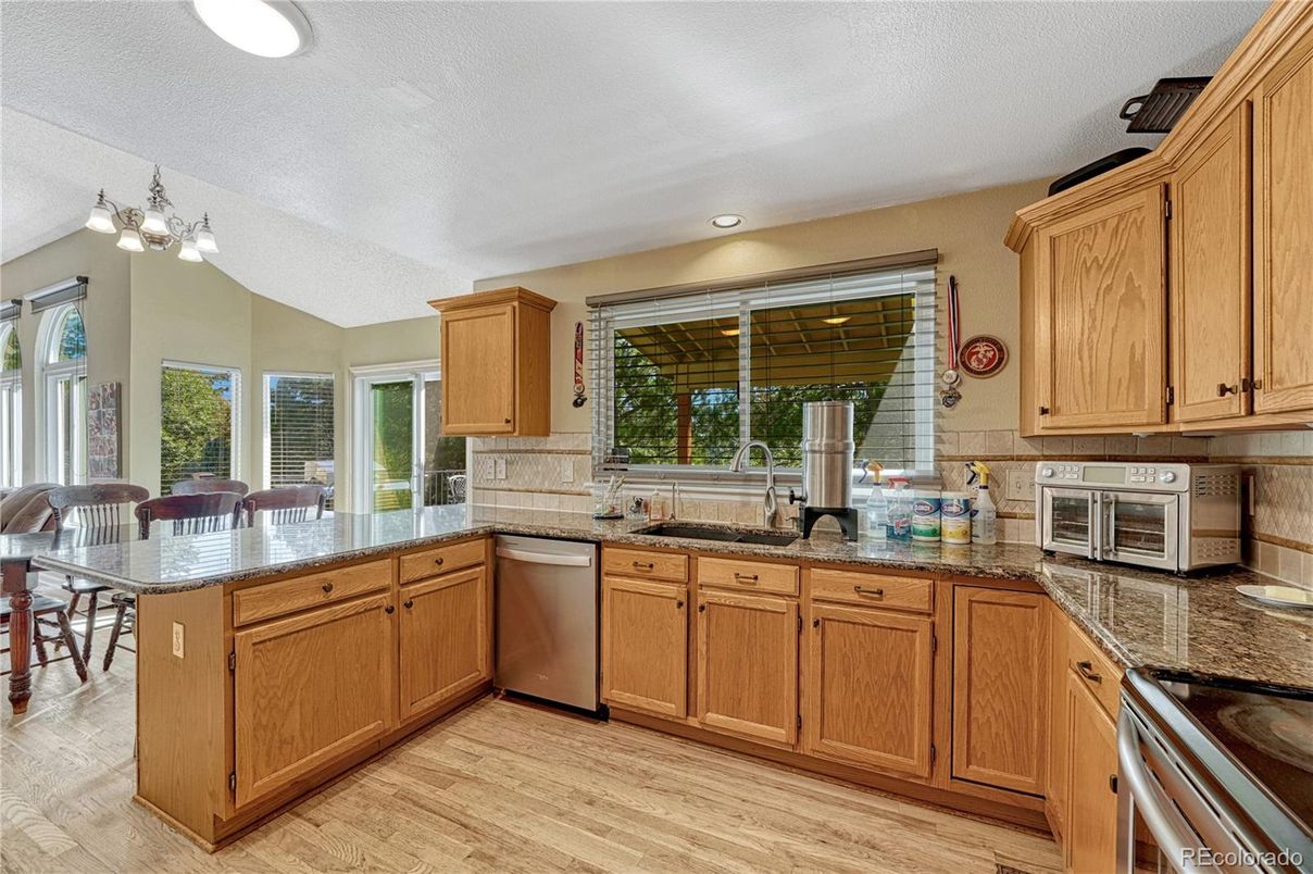Dining room, Interior, Kitchen, Recessed Lighting, Stainless Steel Appliances, Wood Texture Flooring