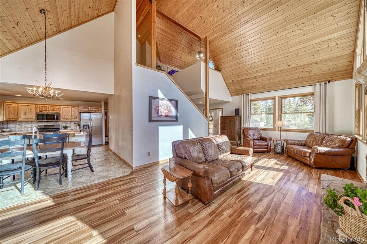 Chandelier, Dining room, Interior, Kitchen, Living room, Pendant Lights, Stainless Steel Appliances, Wooden Ceilings, Wood Texture Flooring