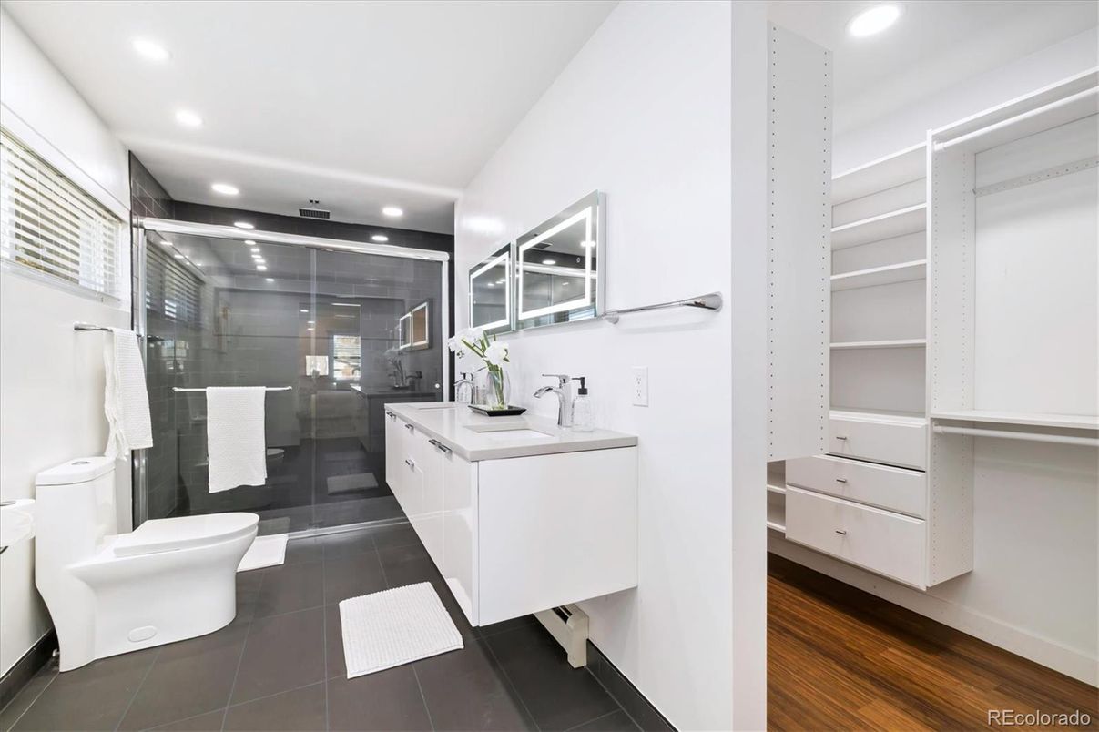 Bathroom, Dual Sink Vanities, Glass Shower, Interior, Recessed Lighting, Walk-in Closets, Wood Texture Flooring