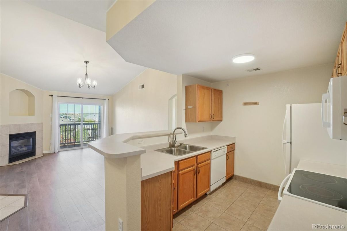 Chandelier, Fireplace, Interior, Kitchen, Recessed Lighting, Wood Texture Flooring