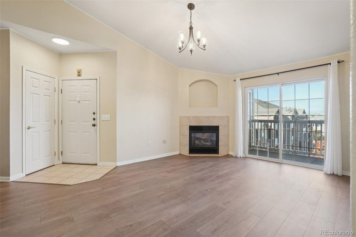 Chandelier, Empty room, Fireplace, Interior, Recessed Lighting, Wood Texture Flooring