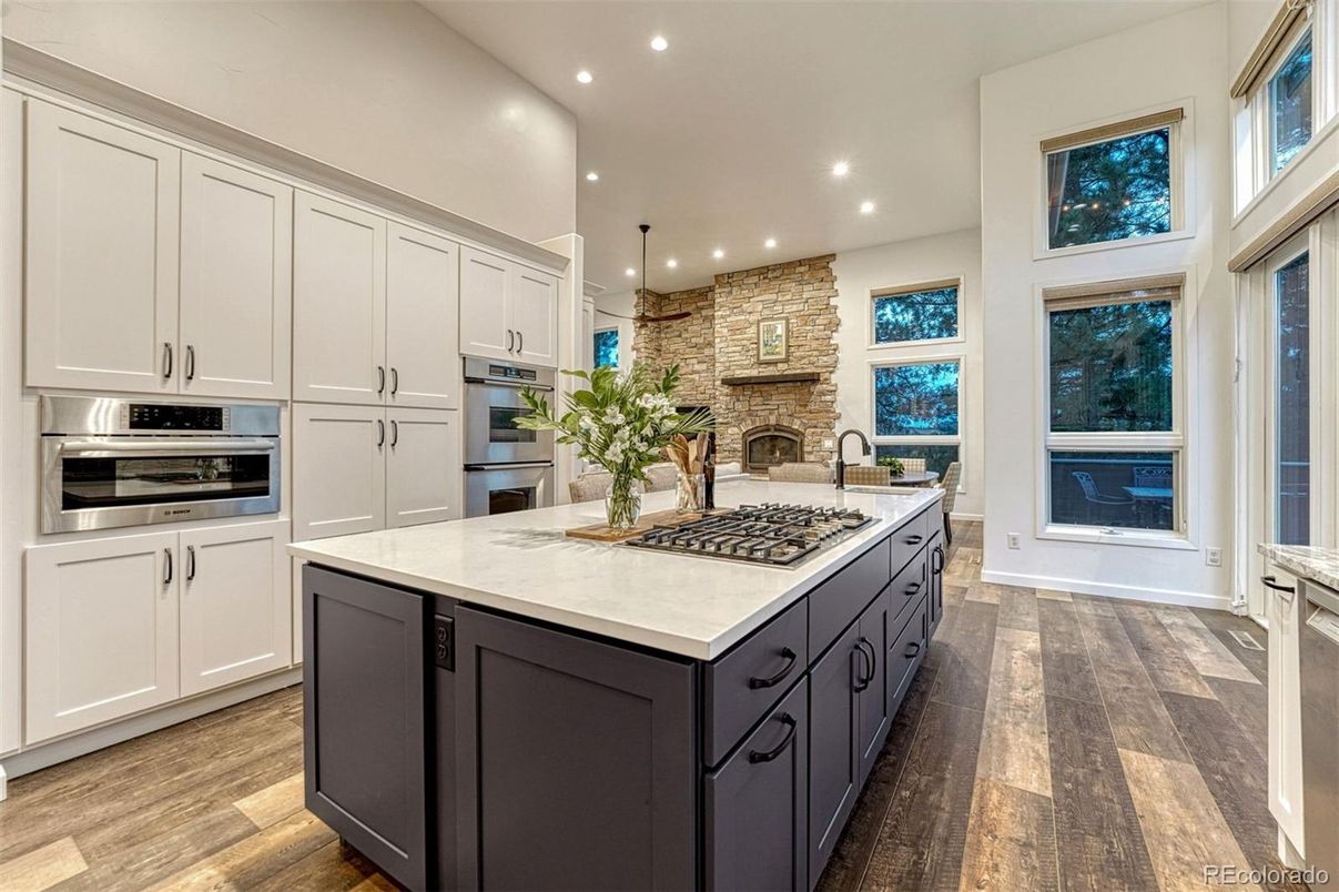 Fireplace, Interior, Kitchen, Pendant Lights, Recessed Lighting, Stainless Steel Appliances, Stone Walls, Wood Texture Flooring