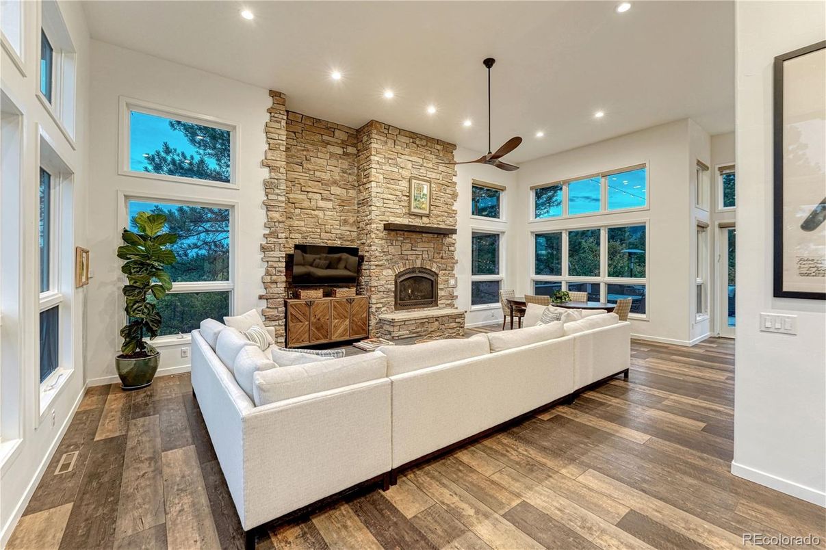 Fireplace, Interior, Living room, Recessed Lighting, Stone Walls, Wood Texture Flooring