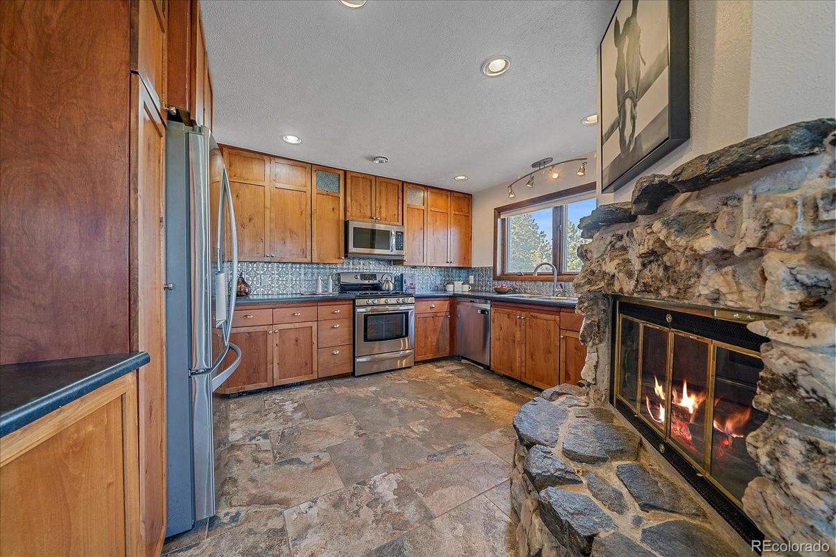 Fireplace, Interior, Kitchen, Recessed Lighting, Stainless Steel Appliances