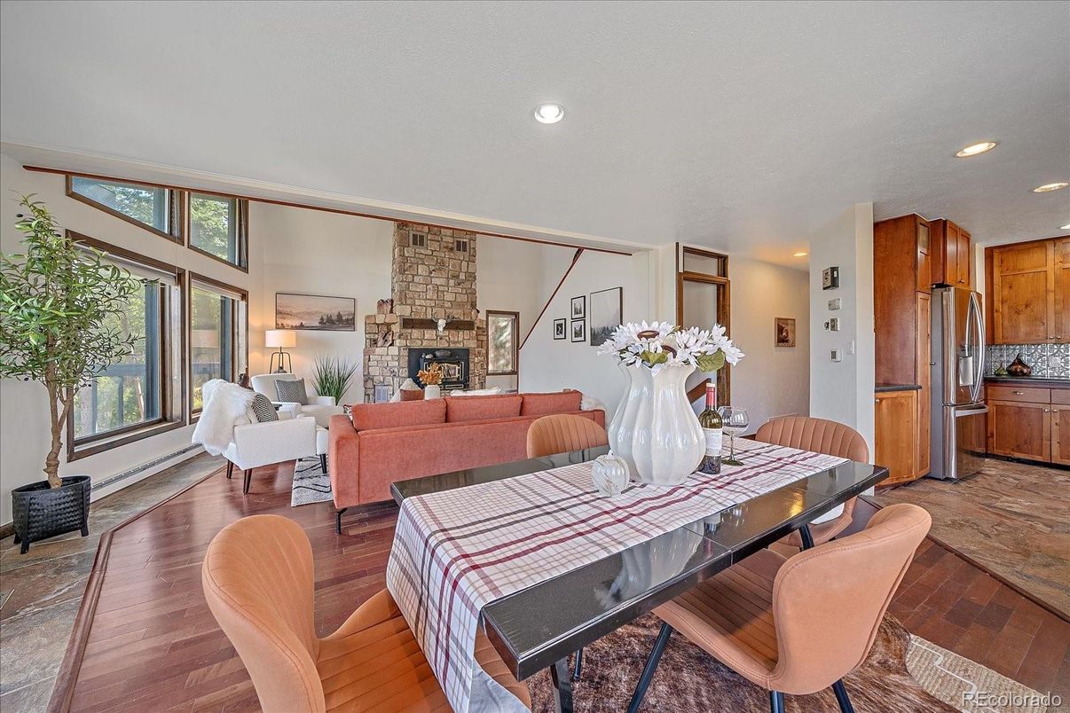 Dining room, Fireplace, Interior, Kitchen, Living room, Recessed Lighting, Stone Walls, Wood Texture Flooring