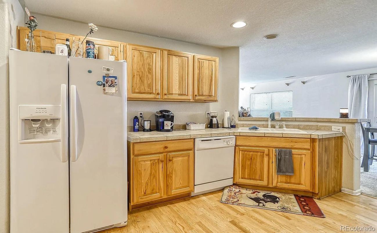 Interior, Kitchen, Recessed Lighting, Tile Countertops, Wood Texture Flooring