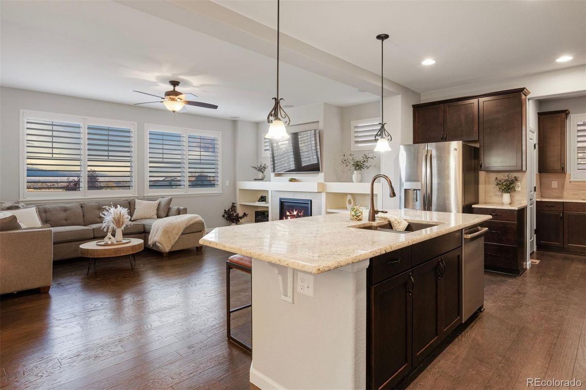 Fireplace, Interior, Kitchen, Living room, Pendant Lights, Recessed Lighting, Stainless Steel Appliances, Wood Texture Flooring